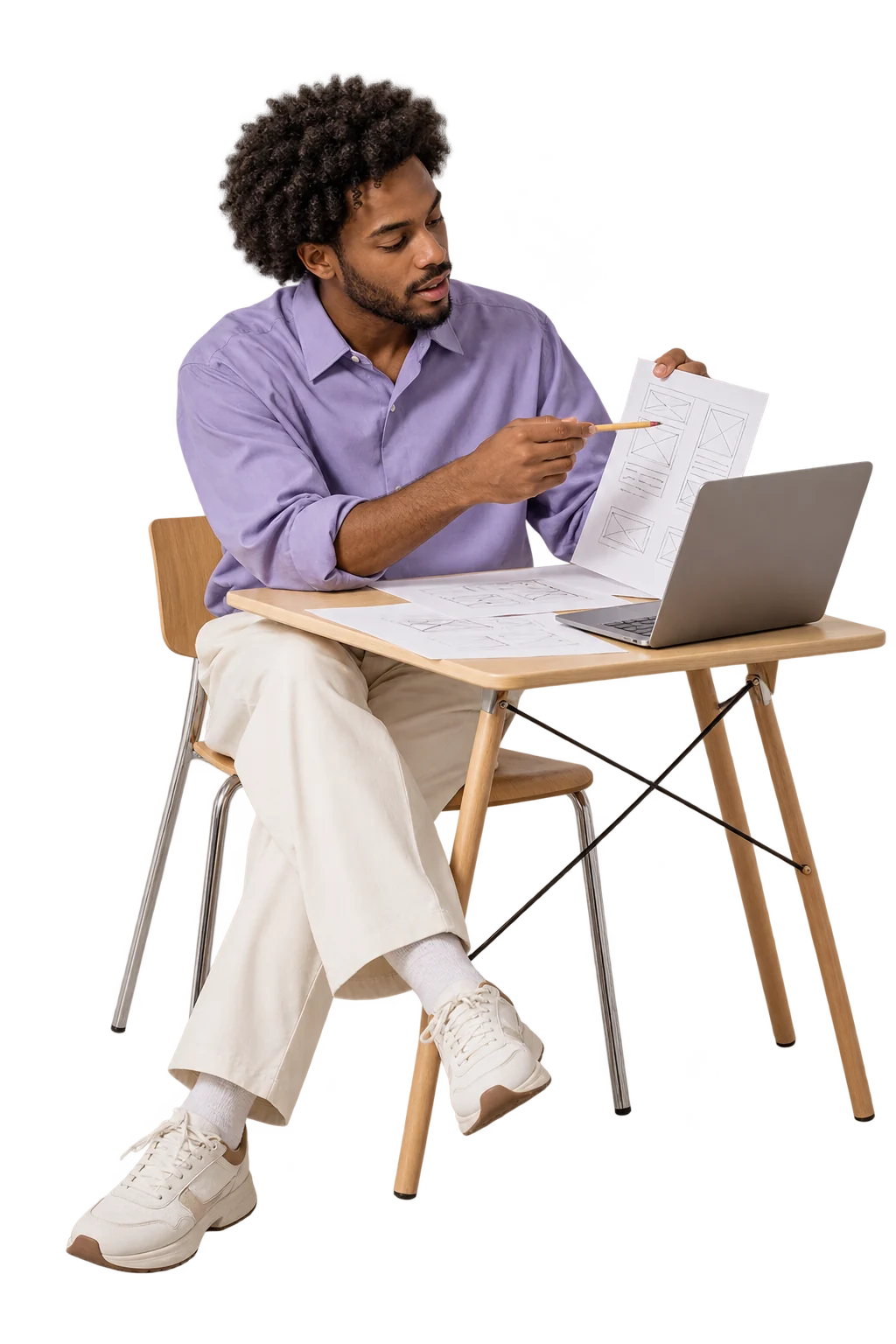 Concepteur de produit dessinant un parcours sur une table de travail